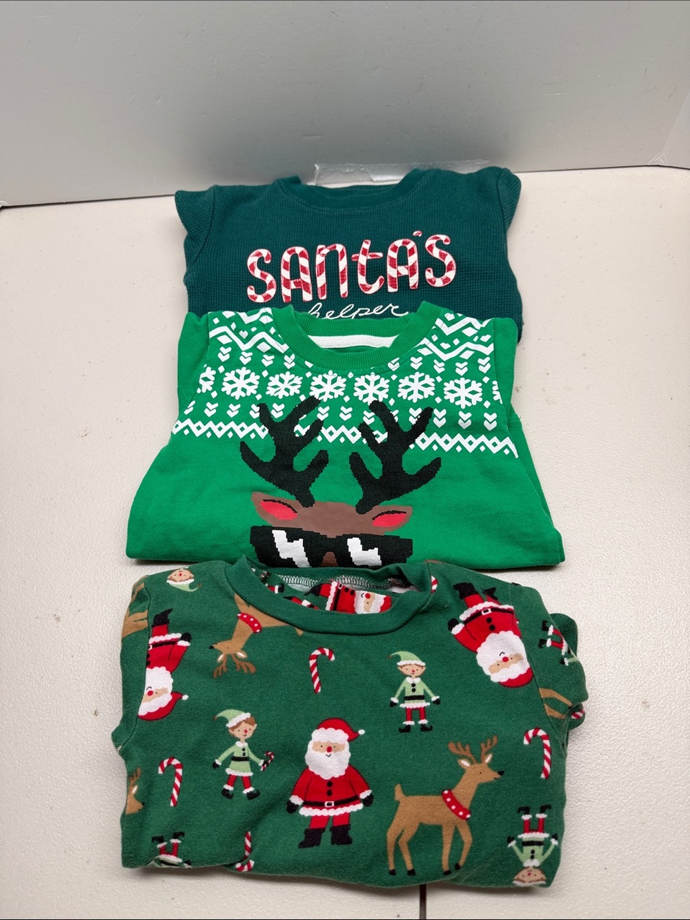 Bundle of Christmas outfits, 1 pajama size 3T, 2 sweaters size 2T